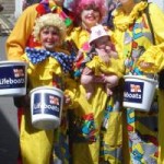 Picture to clowns at Padstow's Easter Egg Rolling Event