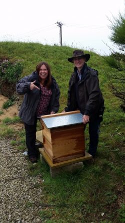 A picture of Mother Ivey's Bay's Gardener Alison with Sarah from David Bellamy Awards and our new beehive