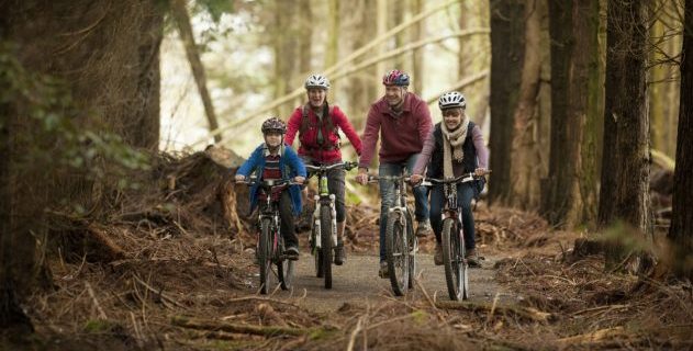 Image of family cycling in lanhydrock