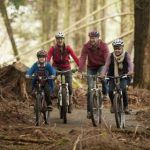 Image of family cycling in lanhydrock