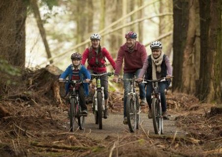 Image of family cycling in lanhydrock